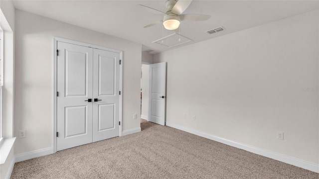 803 Allison Pl, Bartow, FL 33830 - unfurnished bedroom featuring carpet, a closet, a ceiling fan, and attic access