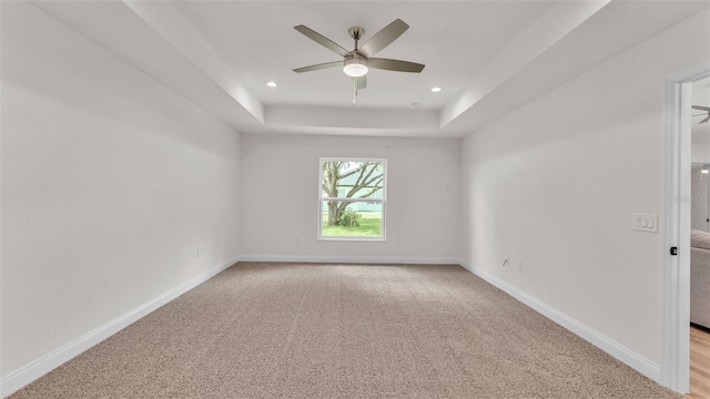803 Allison Pl, Bartow, FL 33830 - spare room with a ceiling fan, light colored carpet, a tray ceiling, and recessed lighting