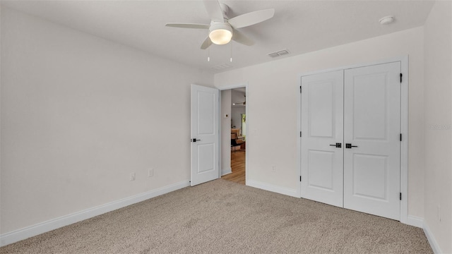 803 Allison Pl, Bartow, FL 33830 - unfurnished bedroom featuring carpet, a closet, and a ceiling fan