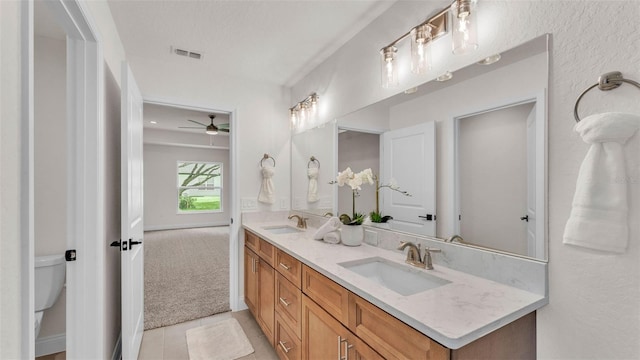 803 Allison Pl, Bartow, FL 33830 - bathroom featuring double vanity, ceiling fan, and tile patterned floors