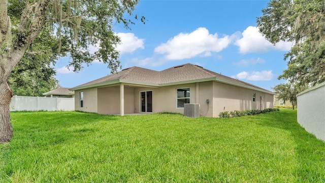 803 Allison Pl, Bartow, FL 33830 - rear view of house with stucco siding and roof with shingles