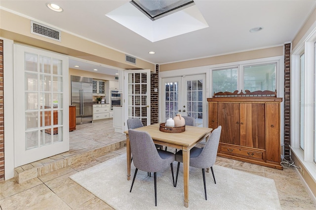 3906 Canyon Lake Pt, Lakeland, FL 33813 - dining area with visible vents, ornamental molding, a skylight, and french doors