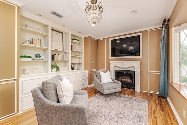 3906 Canyon Lake Pt, Lakeland, FL 33813 - sitting room with a premium fireplace, crown molding, a healthy amount of sunlight, and visible vents