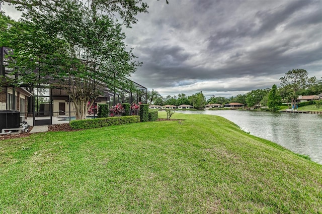 3906 Canyon Lake Pt, Lakeland, FL 33813 - view of yard with central AC unit, a water view, a swimming pool, and glass enclosure