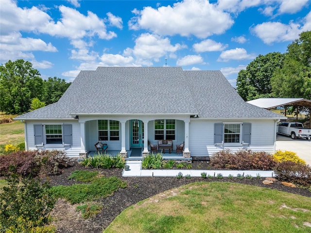 9004 Selph Rd, Lakeland, FL 33810 - view of front of property with roof with shingles, a porch, and a detached carport