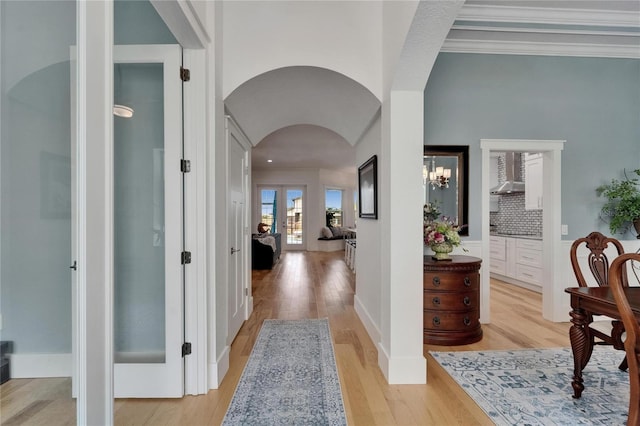 9004 Selph Rd, Lakeland, FL 33810 - corridor featuring crown molding, light wood-style flooring, and arched walkways