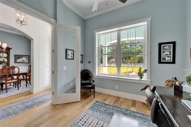 9004 Selph Rd, Lakeland, FL 33810 - interior space with baseboards, light wood-style flooring, crown molding, ceiling fan, and arched walkways