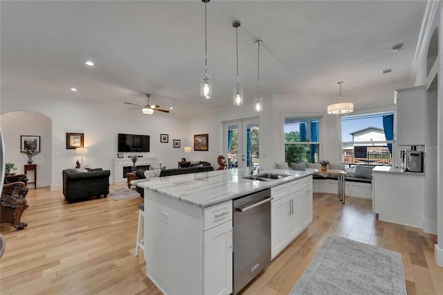 9004 Selph Rd, Lakeland, FL 33810 - kitchen with recessed lighting, light wood-style flooring, a center island with sink, ceiling fan, and stainless steel dishwasher