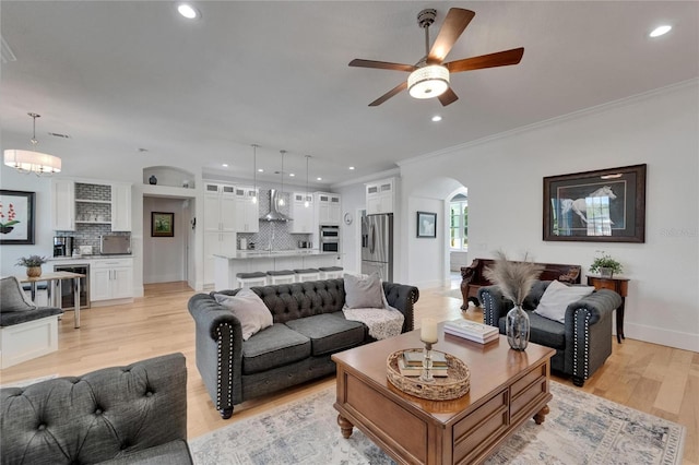 9004 Selph Rd, Lakeland, FL 33810 - living area with baseboards, recessed lighting, ceiling fan, arched walkways, and light wood finished floors