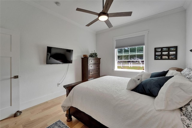 9004 Selph Rd, Lakeland, FL 33810 - bedroom featuring ornamental molding, baseboards, light wood finished floors, and a ceiling fan