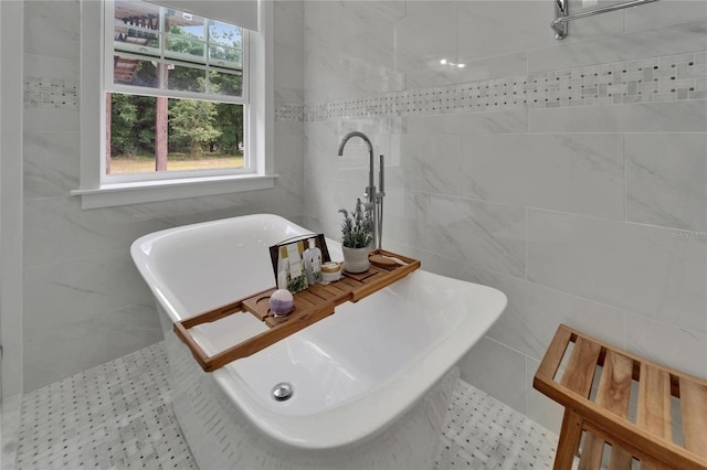 9004 Selph Rd, Lakeland, FL 33810 - bathroom featuring tile walls and a soaking tub