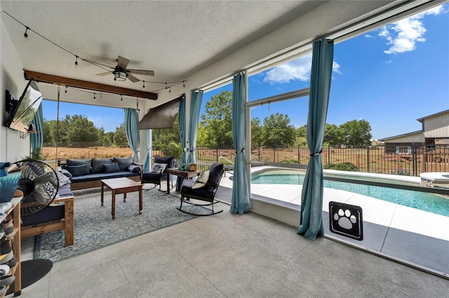 9004 Selph Rd, Lakeland, FL 33810 - sunroom with a ceiling fan, rail lighting, and an outdoor hangout area