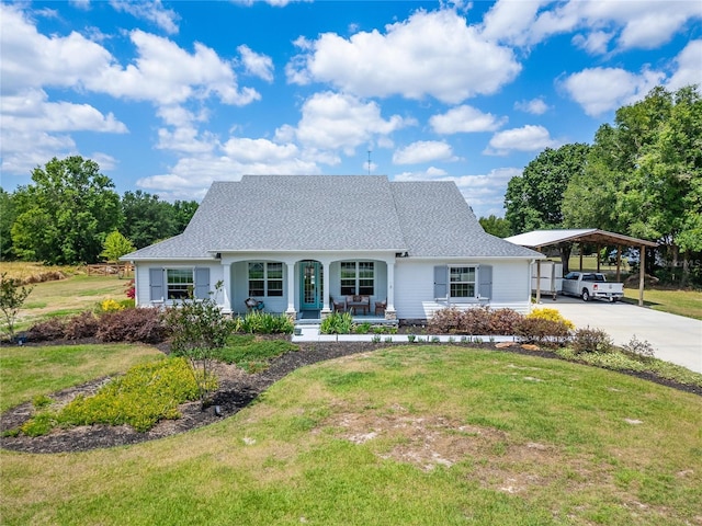 9004 Selph Rd, Lakeland, FL 33810 - view of front of home with a porch, concrete driveway, and a front lawn