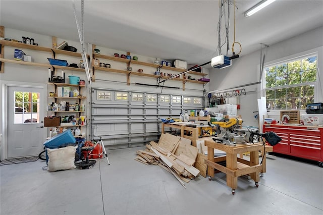 9004 Selph Rd, Lakeland, FL 33810 - garage featuring a workshop area and a garage door opener
