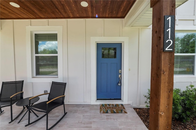 entrance to property featuring board and batten siding