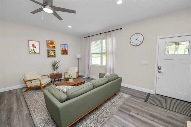 living area with recessed lighting, baseboards, a ceiling fan, and wood finished floors