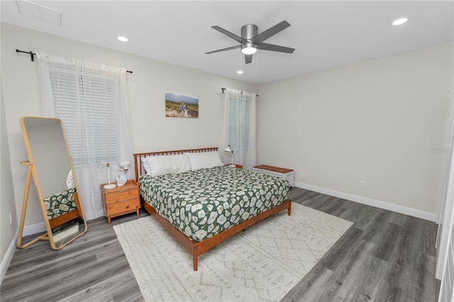 bedroom featuring baseboards, recessed lighting, wood finished floors, and a ceiling fan