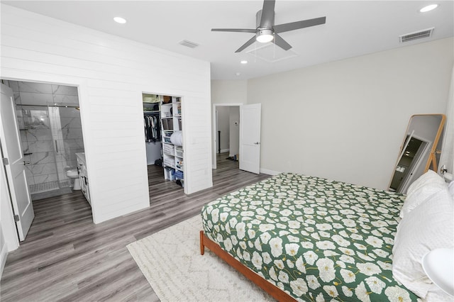 bedroom with visible vents, recessed lighting, a closet, and wood finished floors
