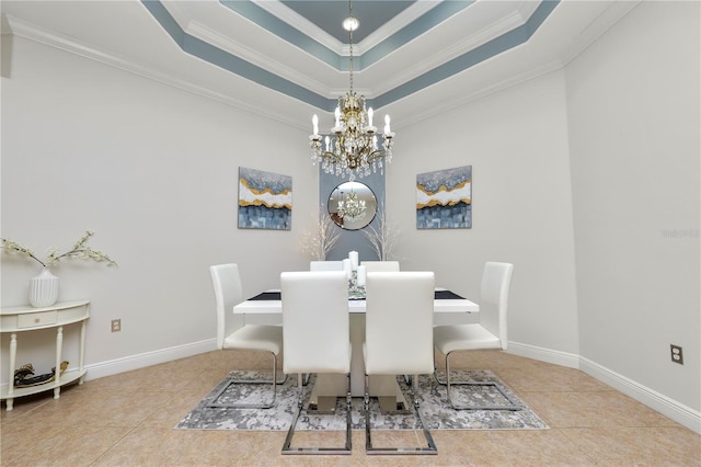 tiled dining area with a chandelier, crown molding, a tray ceiling, and baseboards