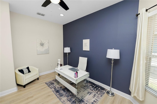 office featuring a ceiling fan, light wood finished floors, baseboards, plenty of natural light, and recessed lighting