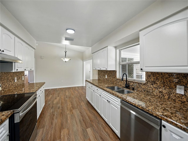 kitchen featuring under cabinet range hood, baseboards, a sink, stainless steel appliances, and white cabinets