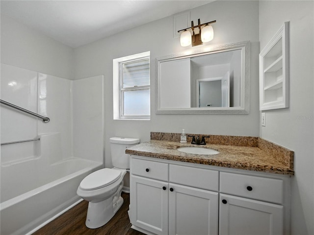 full bathroom featuring toilet, vanity, shower / tub combination, and wood finished floors