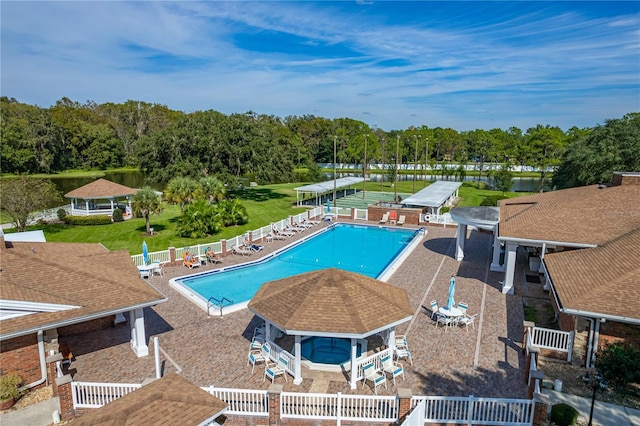 community pool with a patio, a gazebo, and a fenced backyard