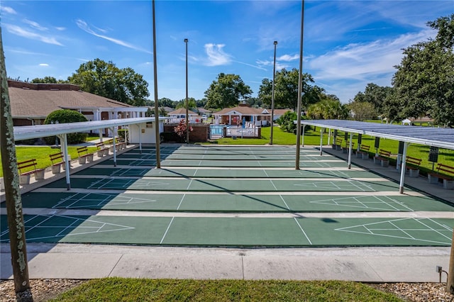 view of property's community featuring shuffleboard