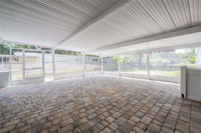 unfurnished sunroom with a healthy amount of sunlight