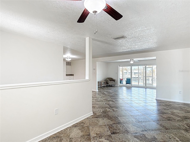 4921 Marlin Dr, New Port Richey, FL 34652 - interior space with visible vents, baseboards, a ceiling fan, and a textured ceiling