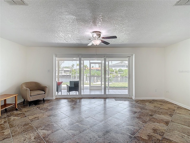 4921 Marlin Dr, New Port Richey, FL 34652 - interior space with baseboards, a ceiling fan, and a healthy amount of sunlight