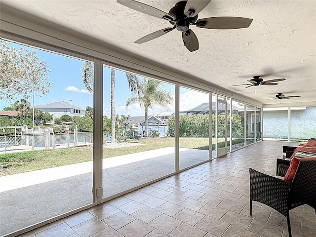 4921 Marlin Dr, New Port Richey, FL 34652 - sunroom / solarium with a wealth of natural light, a textured ceiling, and ceiling fan