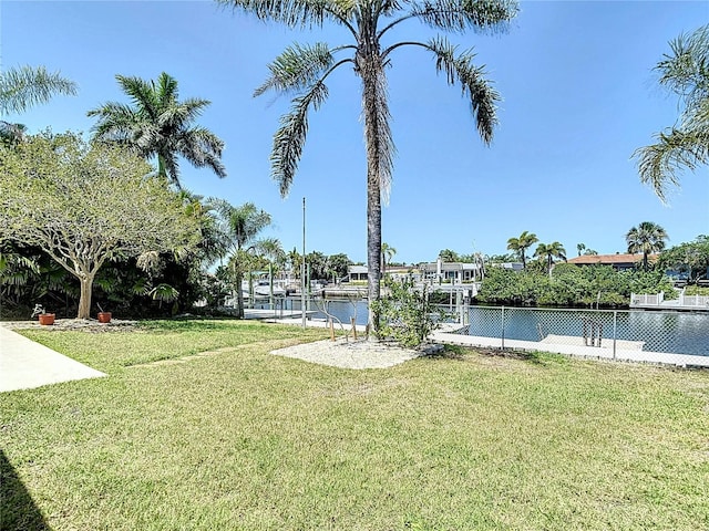 4921 Marlin Dr, New Port Richey, FL 34652 - view of yard with a water view, fence, and a dock