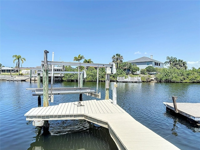 4921 Marlin Dr, New Port Richey, FL 34652 - view of dock with boat lift and a water view