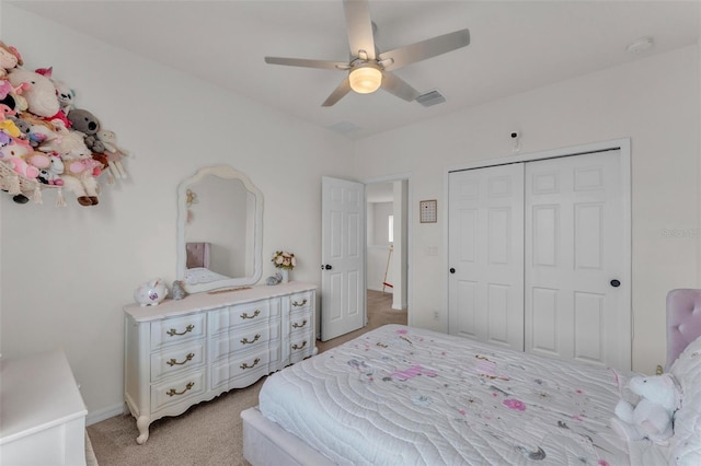 bedroom featuring light carpet, visible vents, baseboards, a closet, and ceiling fan