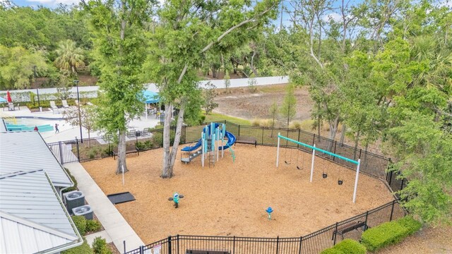 view of community featuring fence and playground community