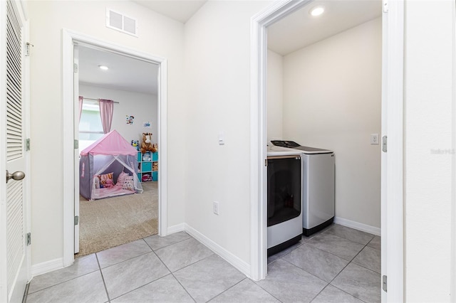 washroom with light tile patterned flooring, visible vents, recessed lighting, separate washer and dryer, and laundry area
