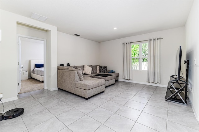 living area featuring recessed lighting, baseboards, visible vents, and light tile patterned floors