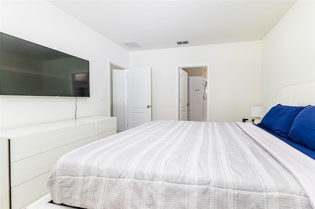 bedroom featuring visible vents