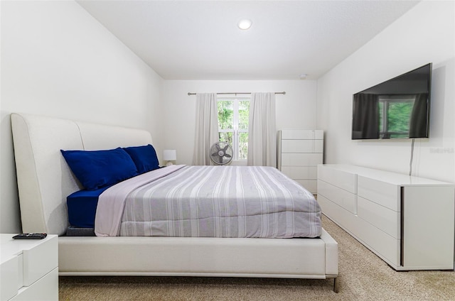 bedroom with recessed lighting and light carpet