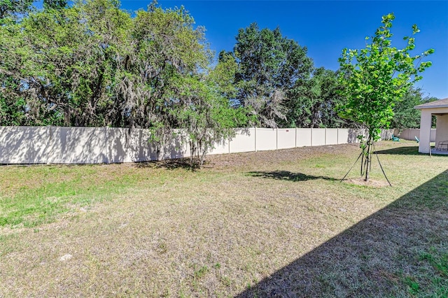 view of yard with a fenced backyard