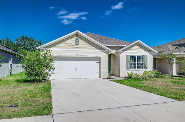 ranch-style house with a shingled roof, a front lawn, stucco siding, driveway, and a garage