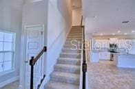stairway featuring a wealth of natural light