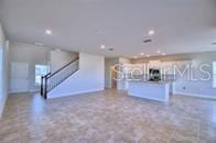 kitchen with baseboards, recessed lighting, and open floor plan