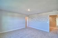 interior space with baseboards and carpet floors