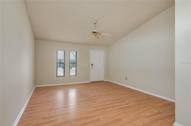 6315 Conductor Ct, Lakeland, FL 33813 - empty room featuring baseboards, lofted ceiling, a ceiling fan, and light wood-style flooring