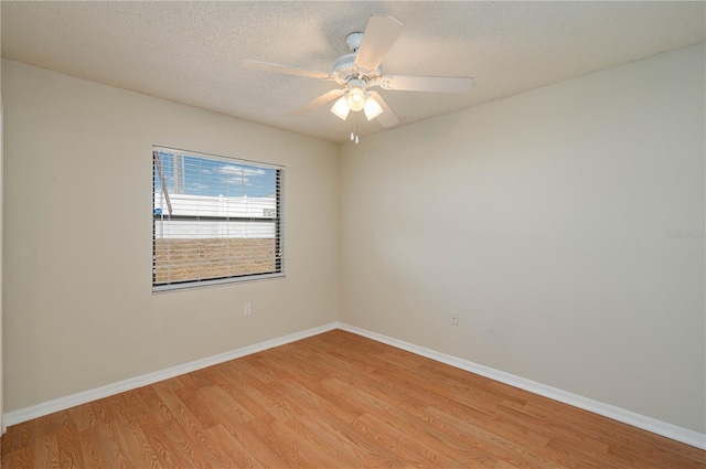 6315 Conductor Ct, Lakeland, FL 33813 - empty room featuring light wood-style floors, a textured ceiling, baseboards, and ceiling fan