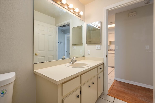 6315 Conductor Ct, Lakeland, FL 33813 - half bath with visible vents, tile patterned floors, vanity, and toilet