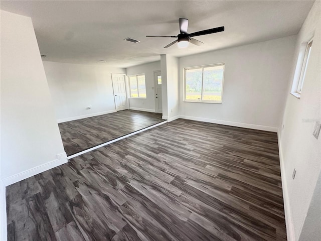 2527 Dons Pl, Lakeland, FL 33801 - unfurnished bedroom featuring dark wood-type flooring, baseboards, and a ceiling fan