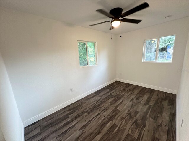 2527 Dons Pl, Lakeland, FL 33801 - unfurnished room featuring dark wood finished floors, baseboards, and ceiling fan